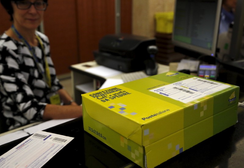 © Reuters. A package is seen on the desk at the headquater of Poste Italiane downtown Milan