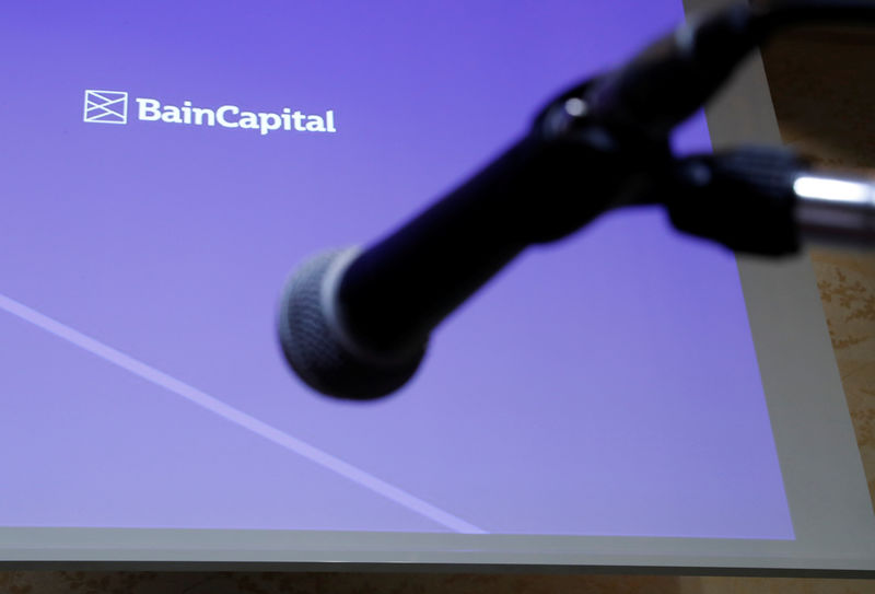 © Reuters. Logo of the Bain Capital is screened at a news conference in Tokyo