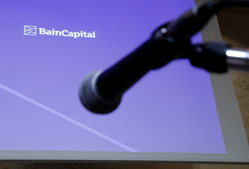 © Reuters. FILE PHOTO - Logo of the Bain Capital is screened at a news conference in Tokyo