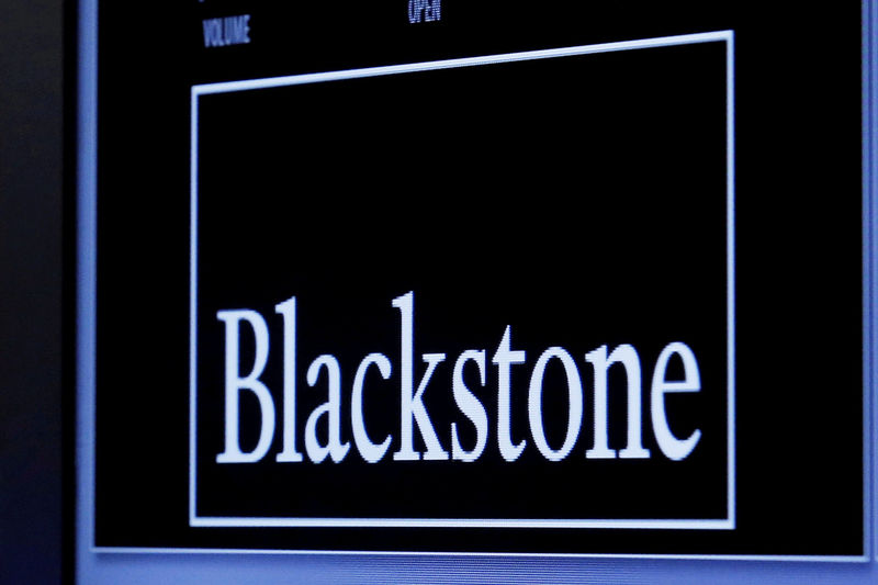 © Reuters. FILE PHOTO -  The logo of Blackstone Group is displayed at the post where it is traded on the floor of the New York Stock Exchange