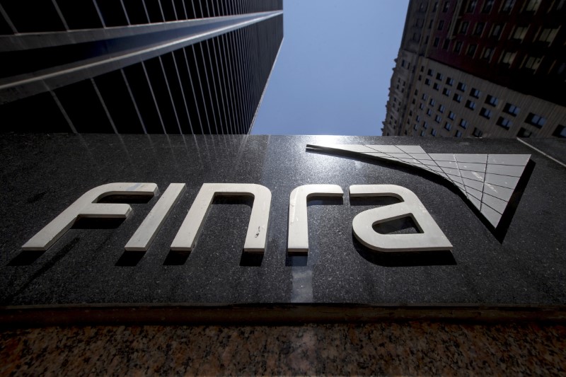 © Reuters. FILE PHOTO --  A sign for the Financial Industry Regulatory Authority (FINRA) is seen outside the offices in New York's financial district