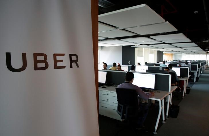 © Reuters. Employees work inside Uber COE in Cairo