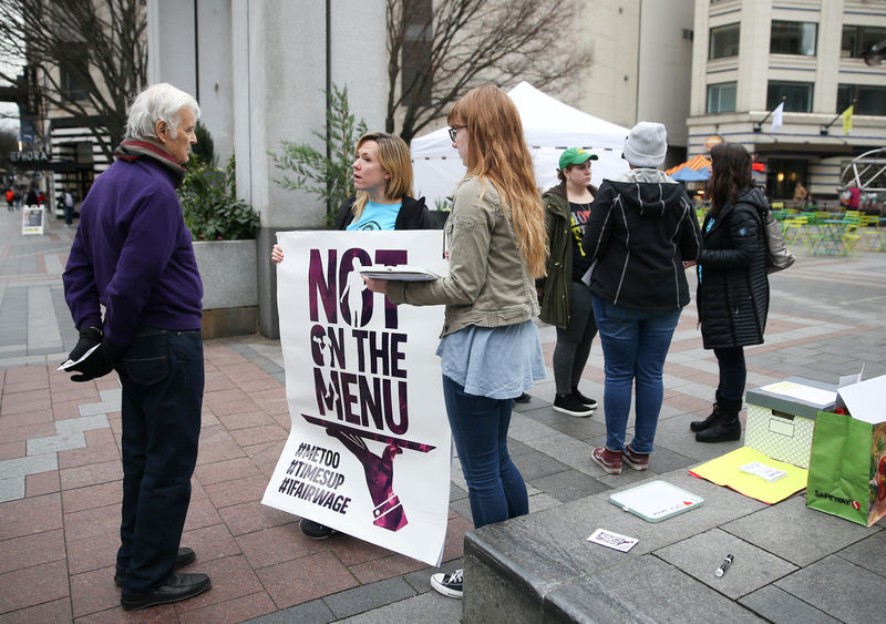 © Reuters. Keele and Basse raise awareness during the #NotOntheMenu rally in Seattle