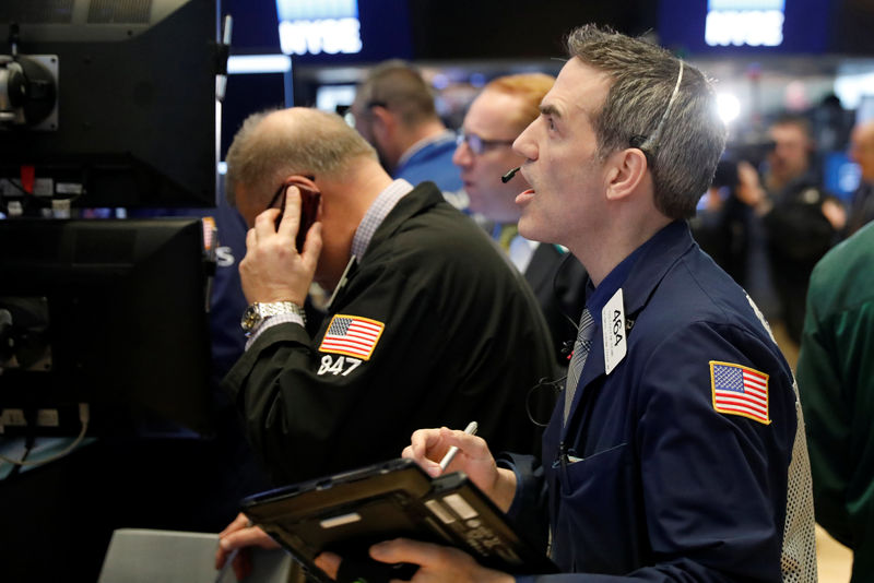 © Reuters. Traders work on the floor of the New York Stock Exchange shortly after the opening bell in New York