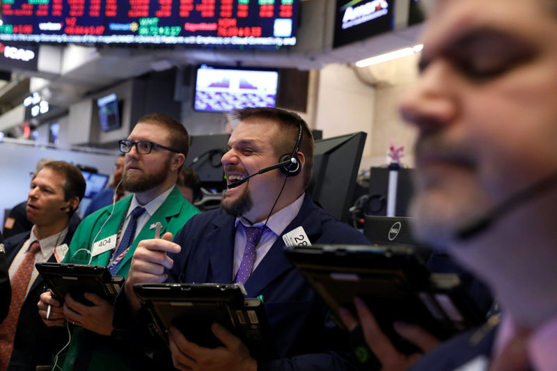 © Reuters. Traders work on the floor of the New York Stock Exchange shortly after the opening bell in New York