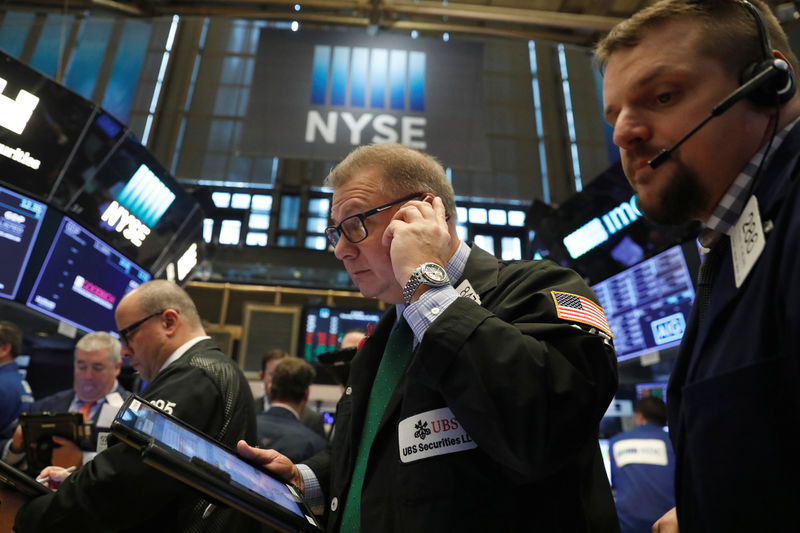 © Reuters. Traders work on the floor of the New York Stock Exchange shortly after the opening bell in New York