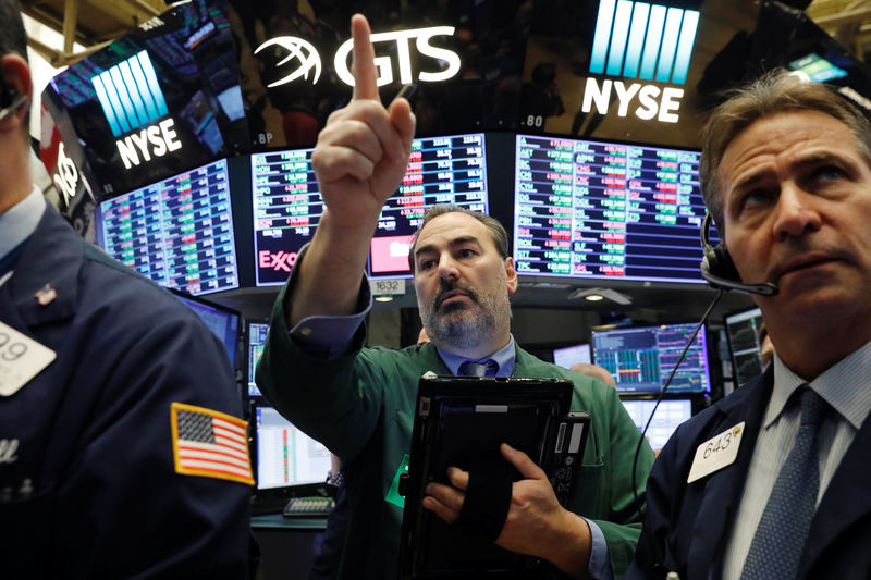 © Reuters. Traders work on the floor of the New York Stock Exchange shortly after the opening bell in New York