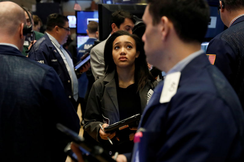 © Reuters. Traders work on the floor of the New York Stock Exchange shortly after the opening bell in New York