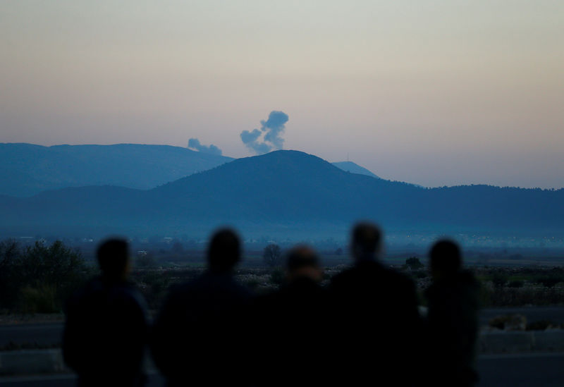 © Reuters. Smoke rises from the Syria's Afrin region, as it is pictured from near the Turkish town of Hassa, on the Turkish-Syrian border in Hatay province