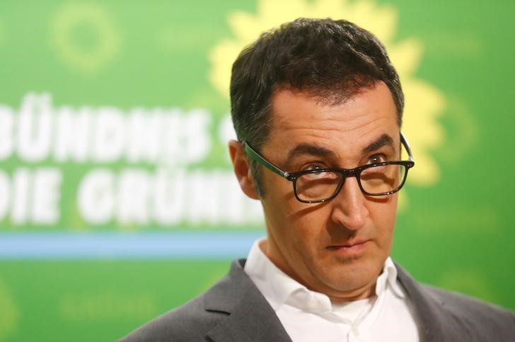 © Reuters. Cem Ozdemir of the German Green party looks on during a press conference at the party headquarters in Berlin