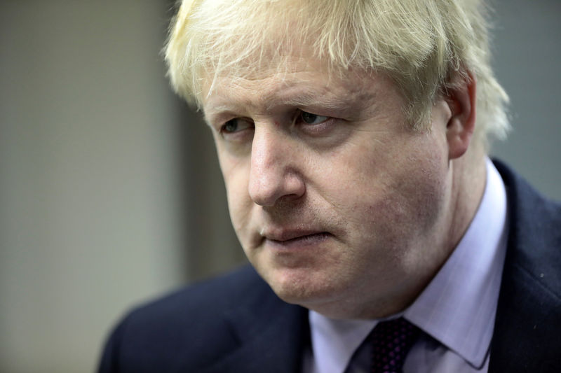 © Reuters. Britain's Foreign Secretary Boris Johnson, listens during a visit to a Metropolitan Police wildlife crime unit in London