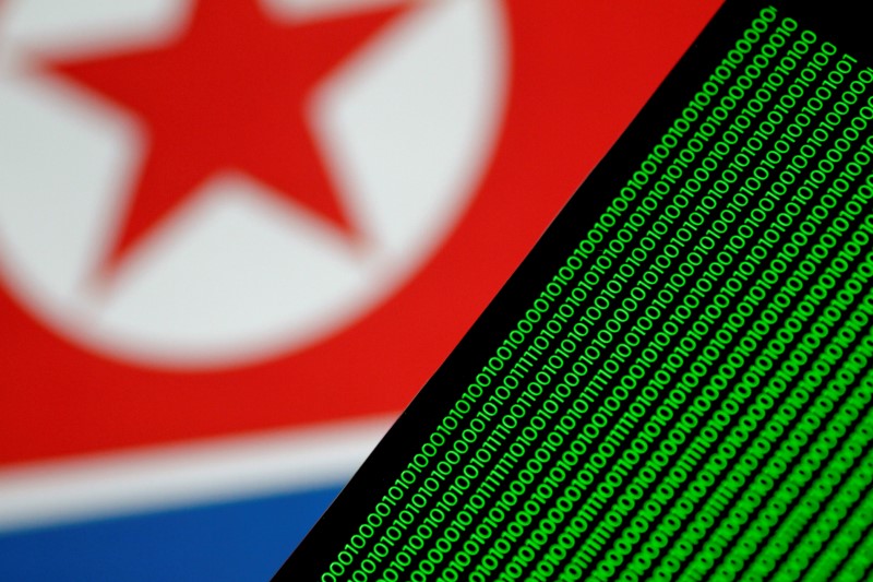© Reuters. Illustration photo of binary code against a North Korean flag