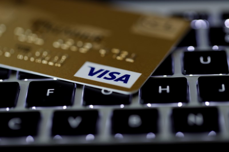 © Reuters. FILE PHOTO: A Visa credit card is seen on a computer keyboard in this picture illustration