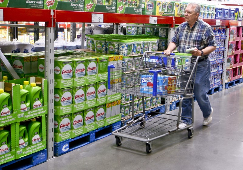 © Reuters. FILE PHOTO - A customer shops along the cleaning product aisle at a Sam's Club store in Bentonville