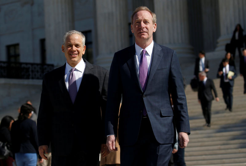 © Reuters. Microsoft President and Chief Legal Officer Brad Smith and his lawyer Josh Rosenkranz make statements about their case outside of the U.S. Supreme Court