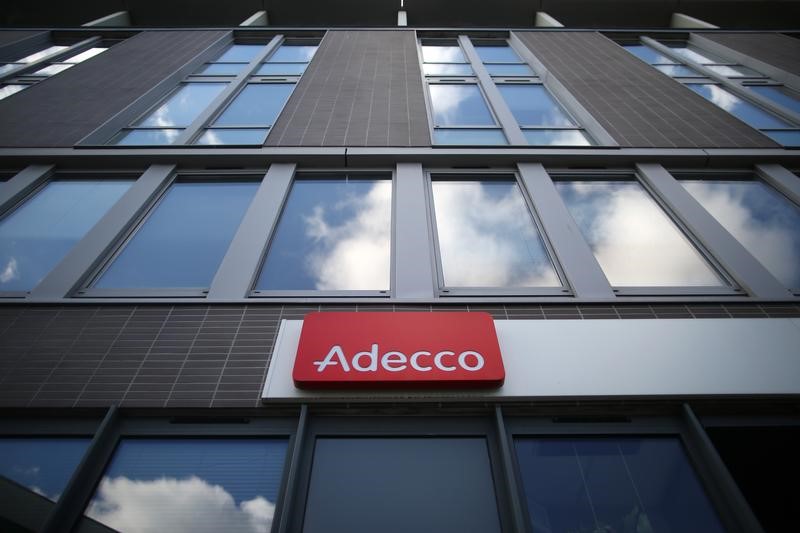 © Reuters. The logo of Adecco is seen in front of a the group's commercial employment agency in Nantes