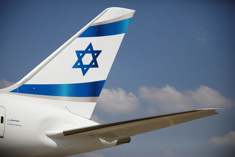 © Reuters. FILE PHOTO: An Israeli flag is seen on the first of Israel's El Al Airlines order of 16 Boeing 787 Dreamliner jets, as it lands at Ben Gurion International Airport, near Tel Aviv