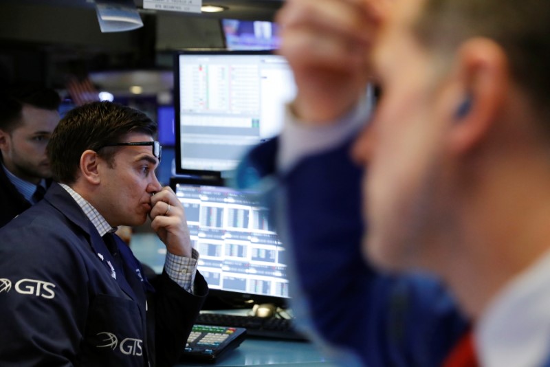 © Reuters. Traders work on the floor of the New York Stock Exchange shortly after the opening bell in New York