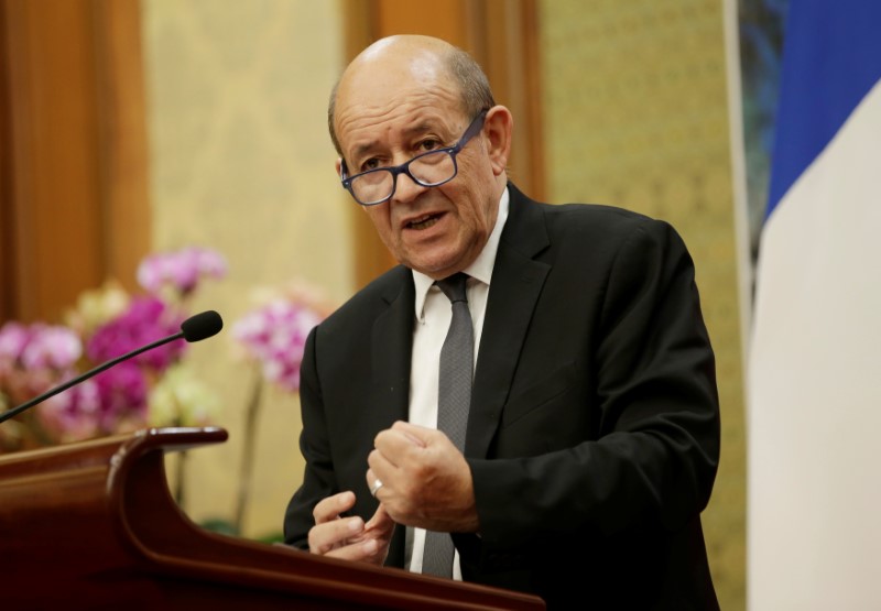 © Reuters. LE DRIAN POUR DES REPRÉSAILLES CONTRE LES TARIFS DOUANIERS AMERICAINS