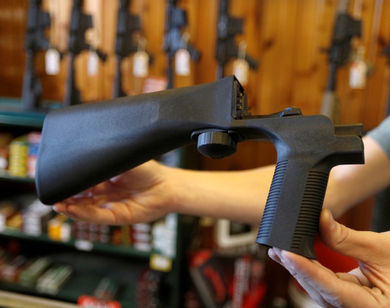 © Reuters. FILE PHOTO: An example of a bump stock that attaches to a semi-automatic rifle is seen at Good Guys Gun Shop in Orem