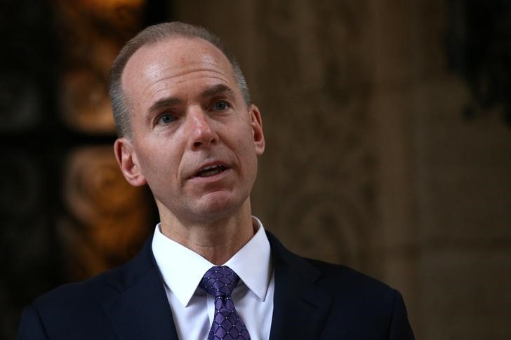 © Reuters. FILE PHOTO - Boeing CEO Dennis Muilenburg leaves  talks to members of the media after a meeting with U.S. President-elect Donald Trump at Mar-a-Lago estate in Palm Beach, Florida, U.S.