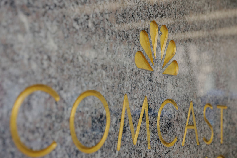 © Reuters. The NBC and Comcast logos are displayed on 30 Rockefeller Plaza in midtown Manhattan in New York