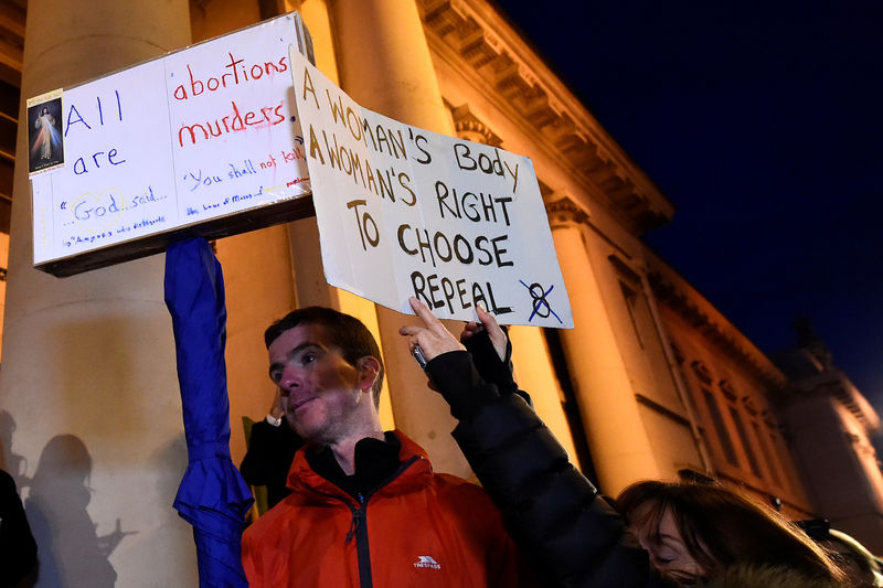 © Reuters. FILE PHOTO - An anti-abortion protestor interrupts speeches during a  march for more liberal Irish abortion laws, in Dublin