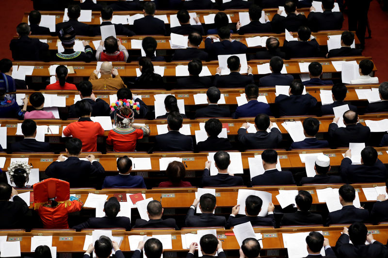 © Reuters. Delegates attend the fourth plenary session of the National People's Congress (NPC)