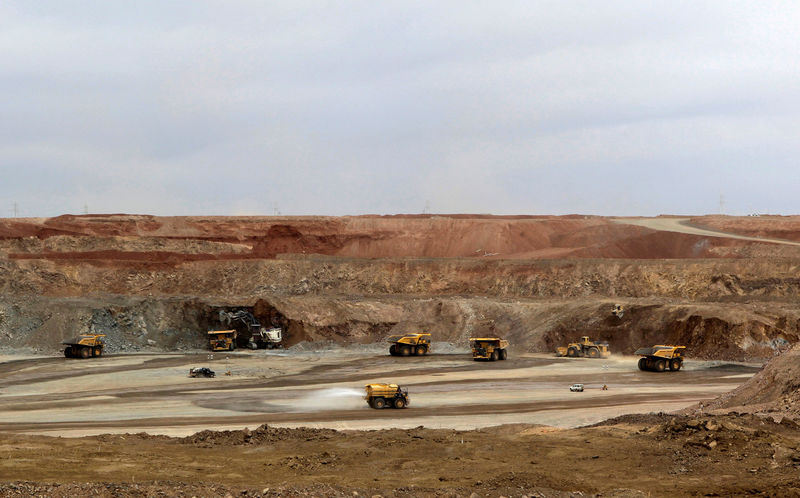 © Reuters. FILE PHOTO: Mining trucks are seen at the Oyu Tolgoi mine in Mongolia's South Gobi region