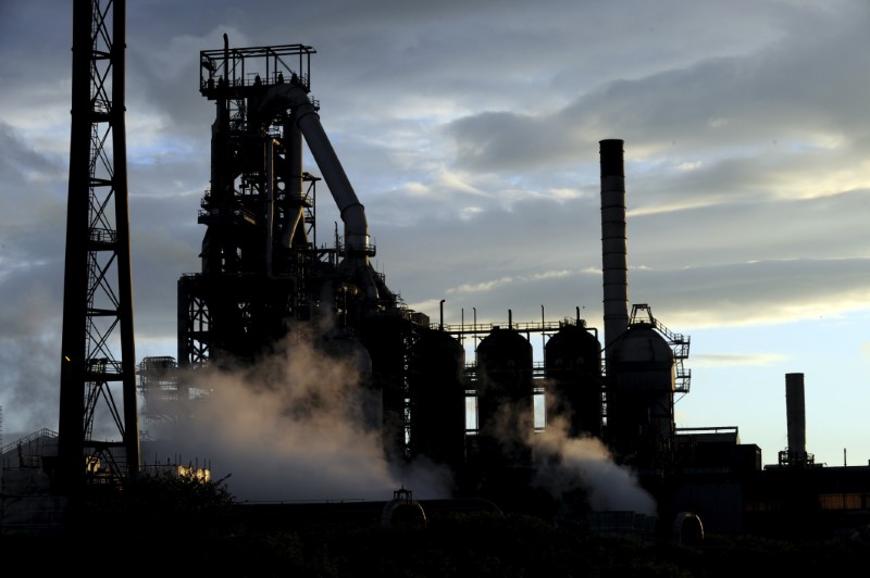 © Reuters. One of the blast furnaces of the Tata Steel plant seen at sunset in Port Talbot