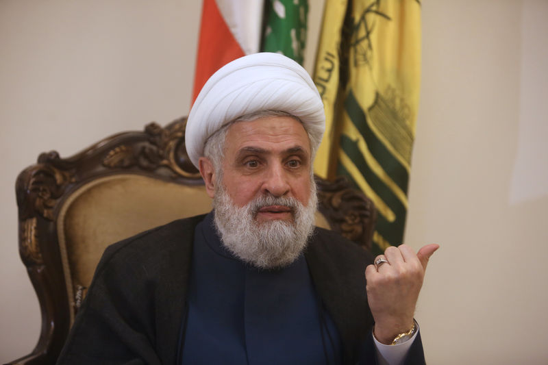 © Reuters. Lebanon's Hezbollah deputy leader Sheikh Naim Qassem gestures as he speaks during an interview with Reuters in Beirut