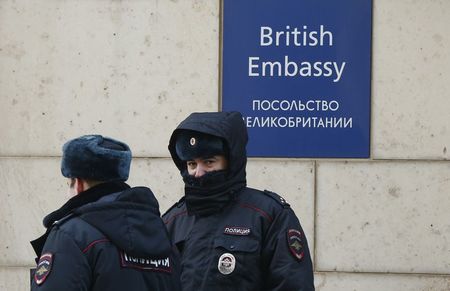 © Reuters. Russian policemen walk outside the British embassy in Moscow