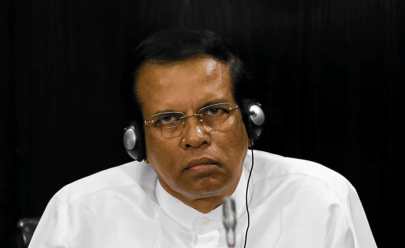 © Reuters. Sri Lanka's President Maithripala Sirisena listens to a speech during a Parliament session marking the 70th anniversary of Sri Lanka's Government, in Colombo
