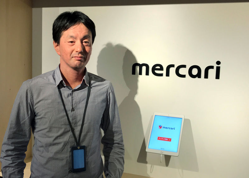 © Reuters. Mercari CEO Shintaro Yamada poses for a photograph during an interview with Reuters in Tokyo