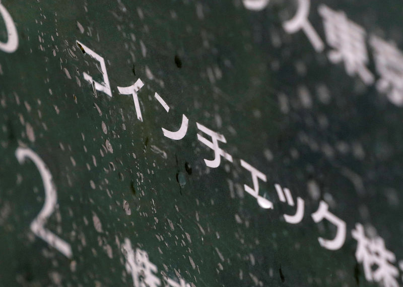 © Reuters. FILE PHOTO: Cryptocurrency exchange Coincheck's signboard is pictured in front of a building where their office is located in Tokyo