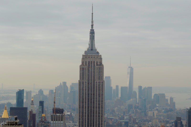 © Reuters. The Empire State Building and One World Trade rise over Manhattan as viewed from the Top of the Rock observation deck in New York