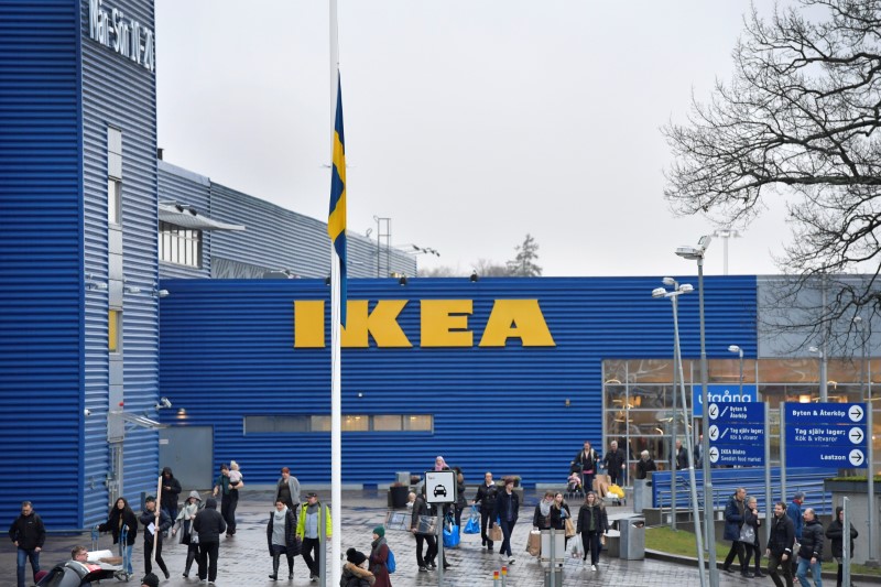© Reuters. A Swedish flag flies at half mast outside an IKEA store in Stockholm