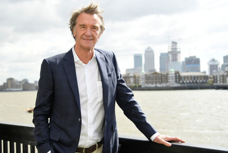 © Reuters. Ratcliffe, CEO of British petrochemicals company INEOS, poses for a portrait with the Canary Wharf financial district seen behind, ahead of a news conference announcing the launch of a British America's Cup sailing team in London, Britain