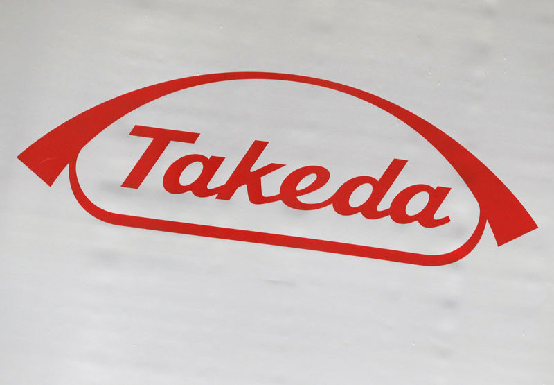 © Reuters. The logo of Takeda Pharmaceutical Co. is displayed at the company's news conference venue in Tokyo