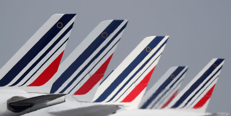 © Reuters. FILE PHOTO: The tails of Air France airplanes parked at the Charles-de-Gaulle airport are seen in Roissy