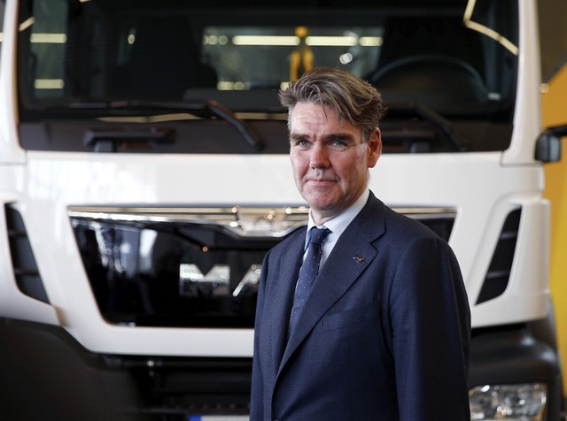 © Reuters. Drees CEO of German truck maker MAN SE, poses in front of a MAN truck in Munich