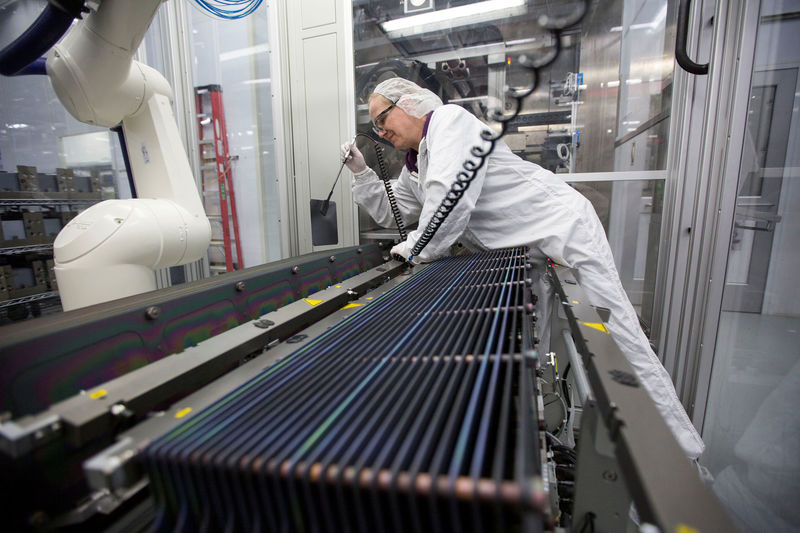 © Reuters. FILE PHOTO: Production operator, Kathy Grady is seen at work at the SolarWorld solar panel factory in Hillsboro