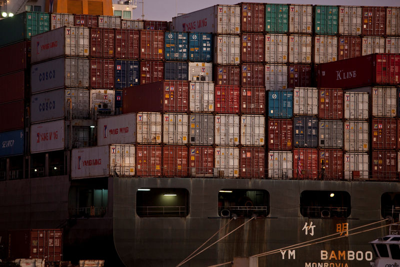 © Reuters. FILE PHOTO: The YM Bamboo, a container ship operated by the China Ocean Shipping Company (COSCO) is docked at the Port of Oakland in Oakland, California