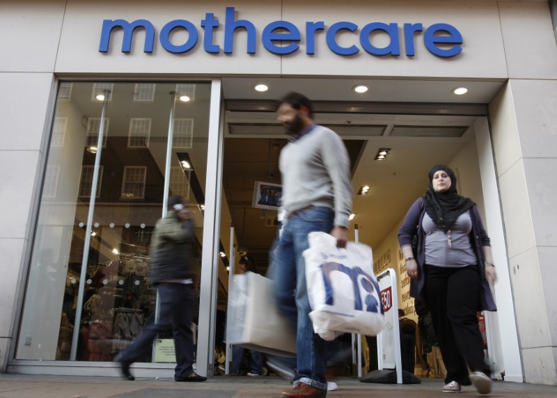 © Reuters. FILE PHOTO: Customers leave a Mothercare shop in London