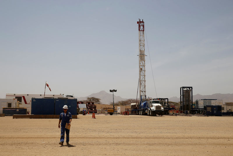 © Reuters. FILE PHOTO: Worker walks at a Tullow Oil explorational drilling site in Lokichar