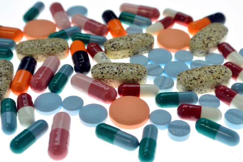 © Reuters. Pharmaceutical tablets and capsules are arranged on table in photo illustration