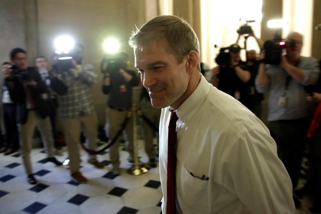 © Reuters. Representative Jim Jordan (R-OH) walks into a Speaker's office