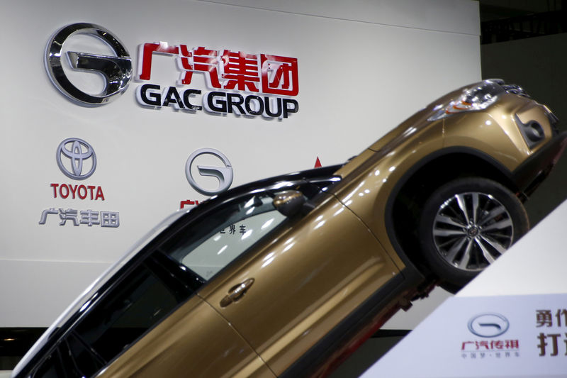 © Reuters. FILE PHOTO: The logo of GAC Group is pictured at its booth during the Auto China 2016 auto show in Beijing