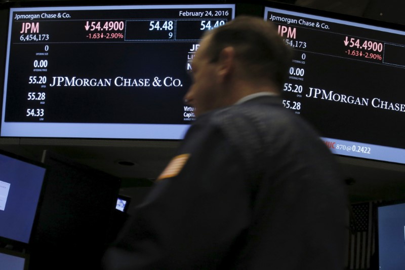 © Reuters. A trader works by the post where JPMorgan Chase & Co is traded on the floor of NYSE