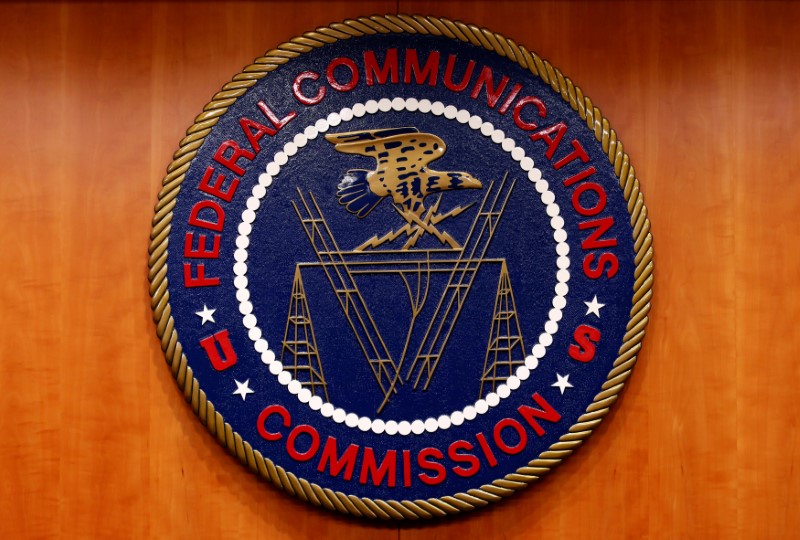 © Reuters. FILE PHOTO: The Federal Communications Commission (FCC) logo is seen before the FCC Net Neutrality hearing in Washington